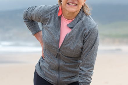 a woman holding her head